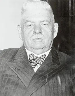 John J. Coughlin Posing in His Office