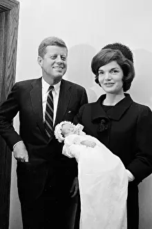 John and Jackie Kennedy with John Jr During Christening