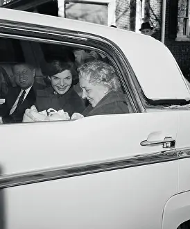 John and Jacqueline Kennedy in Car with Baby Nurse