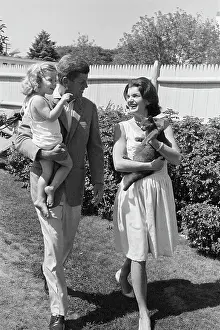 John and Jacqueline Kennedy on Outing with Their Daughter