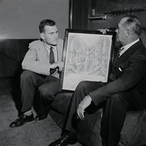 John Kelly Showing His Son His Olympic Award