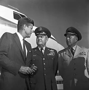 John Kennedy and Military Officers Standing Near Plane