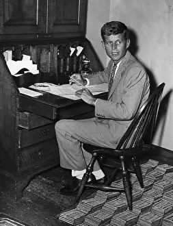 John Kennedy Sitting at Desk