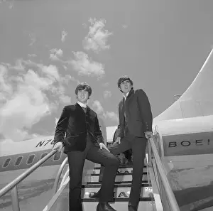 John Lennon and George Harrison Leaving Hawaii