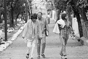John Lennon with George Harrison and Mike Love Outdoors