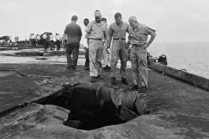 John McCain and Fellow Pilots Examining Hole