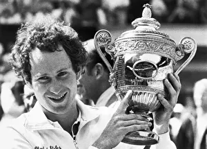 John Mcenroe Holds Winners Trophy