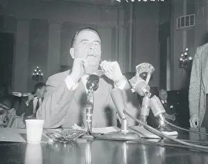 John Peurifoy Holding His Eyeglasses