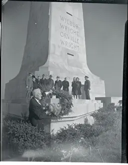 Prints of (Original Caption). First Flight Anniversary. Kitty Hawk, North Carolina--Captain John T Flight Pioneers: The Wright Brothers’ Historic Journey: John T. Daniels at Wright Brothers Flight Anniversary