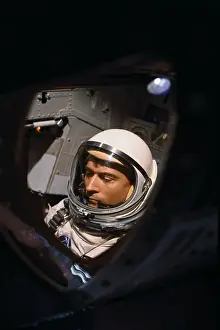 John W Prints: John W. Young Sitting in Capsule