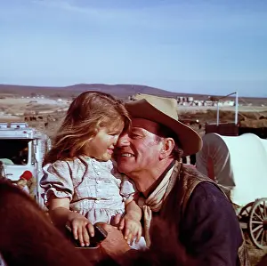 Alamo Prints: John Wayne and Daughter Aissa on Movie Set