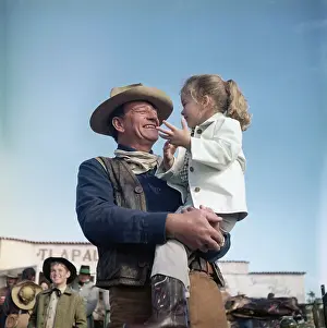 Alamo Prints: John Wayne and Daughter Aissa on Movie Set