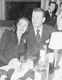 John Wayne and Esperanza Baur at Table