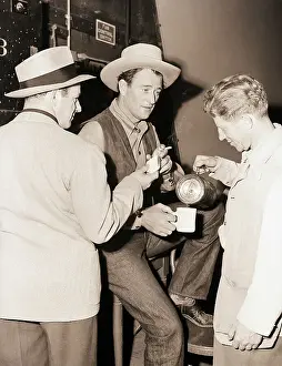 John Wayne Having Coffee Break on Set