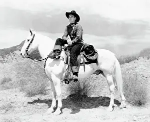 John Wayne Seated On White Horse