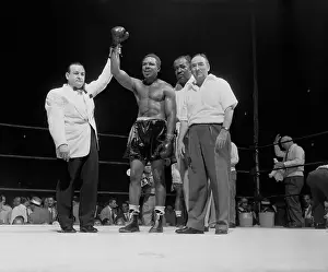 Johnny Addie Holding Archie Moore's Arm Up in Victory