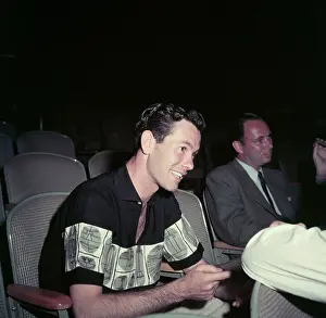 Johnny Carson Sitting as Stage Observer