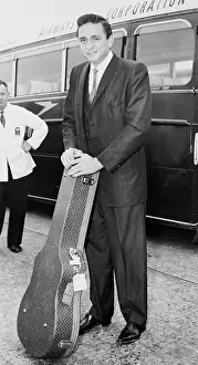 Johnny Cash Standing with Guitar Case