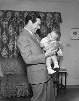 Johnny Mack Brown Holding His Son
