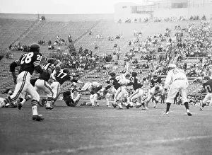 Frenzy Prints: Johnny Robinson Diving Through Air with Football