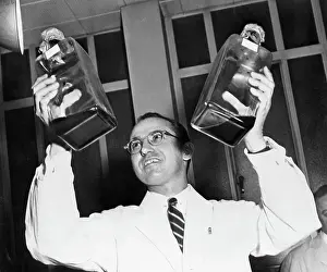 Poliomyelitis Prints: Jonas Salk Holding Bottles of Polio Vaccine
