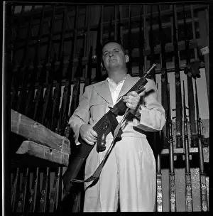 Jose Antonio Remon Carries a Machine Gun