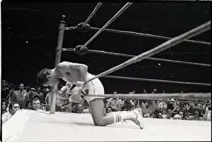 Title Prints: Jose Chavez Leans Over Rope in Boxing Ring