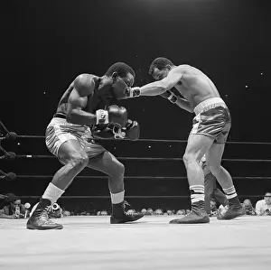 Bout Prints: Jose Torres (R) Punches Dick Tiger