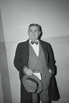 Joseph Lanza Holding Hat with Hand in Pocket