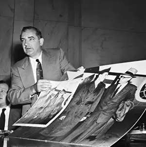 Congress Prints: Joseph McCarthy Holding Large Photographs