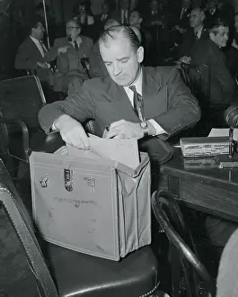 Joseph McCarthy Looking Into Briefcase