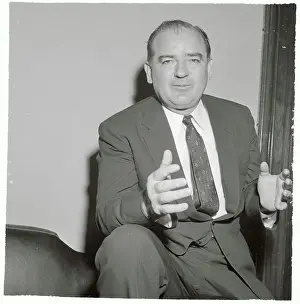 Joseph McCarthy Sitting with One Leg Propped on Couch