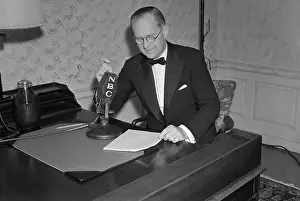 Joseph P. Kennedy Sitting at Microphone