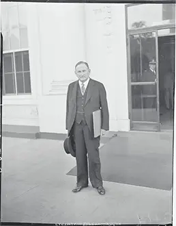 Robinson Prints: Joseph T. Robinson Posing Outside Building