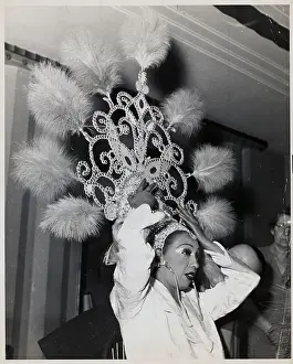 Josephine Baker Puts On Large Headpiece