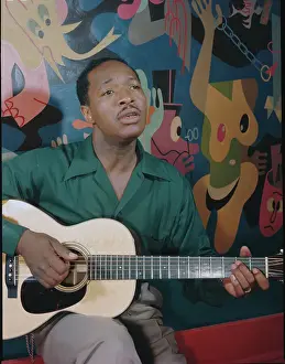Josh White Playing Guitar and Singing