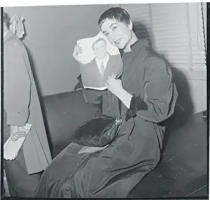 Prints of (Original Caption) The Iconic Moments Captured: Josiane Berenger Holding a Picture of Marlon Brando