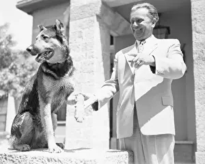 Yugoslavia Prints: Josip Broz Tito Playing with His Dog