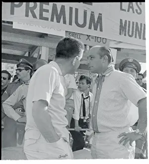 Juan Manuel Fangio Speaking to Colleague