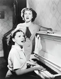 Teenage Girl Prints: Judy Garland and Deanna Durbin Singing at Piano
