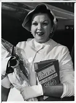 Judy Garland with Flowers Arrives at Airport
