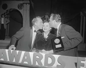 Awards Ceremony Prints: Judy Garland Being Kissed by Bing Crosby and Red Skelton