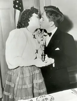 Ceremony Prints: Judy Garland and Mickey Rooney Kissing and Holding Oscar