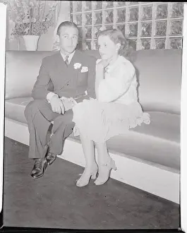 Judy Garland and Perry Frank Sitting on Sofa