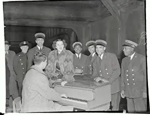 Judy Garland Singing with Train Station Employees at Piano