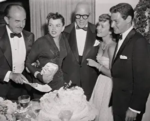 Judy Garland and Others Standing at Banquet Display