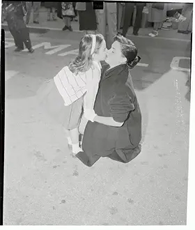 Judy Garland Stooping to Kiss Her Daughter Liza