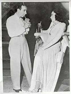 Judy Garland and Vincente Minnelli Talking over Drinks