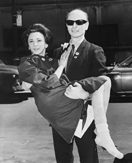 Julian Beck Carrying Wife Into Court