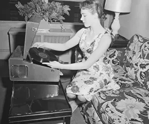 Julie Andrews Putting Record on Phonograph